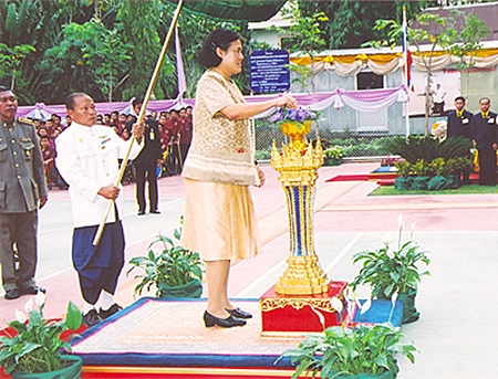 HRH Princess Maha Chakri Sirindhorn pushes the button to officially open the new multi-purpose building at Pattaya Redemptorist Vocational School on February 15, 2007. HRH the Princess then laid the foundation stone for the HRH Princess Maha Chakri Sirindhorn Building at the Pattaya Redemptorist School for the Blind, which is under the patronage of Her Royal Highness. (Photo courtesy Bureau of the Royal Household) 